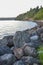 Coastline seawall made of large stacked boulders