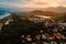 Coastline and town with warm sunset sky in Campeche, Florianopolis. Aerial view