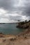 Coastline view of the ocean landscape from the hillside. Peaceful, sunny day holiday destination