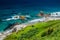 Coastline view from the top of Te Whara Track with blue sky above in Whangarei Heads, Northland, New Zealand