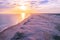 Coastline and white sand dunes at sunset.