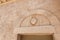 The coat of arms carved in stone on the wall above the entrance to the Deir Al-Mukhraqa Carmelite Monastery in northern Israel