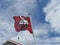 Coat of arms of Horgen as a flag on the mast of the ferry boat, partly visible roof of navigational bridge