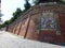 Coat of arms on the red bricks boundaries of the castle of Buda to Budapest in Hungary.