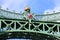 coat of arms on top of the ornate Liberty Bridge in Budapest