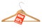 Coat hanger sale tag on white