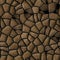 Cobble stones irregular mosaic pattern seamless background - pavement brown colored