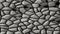 Cobble stones irregular mosaic pattern seamless background - pavement grey natural colored pieces