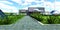 Cobbled footpath on the territory of a futuristic autonomous farm for growing medicinal plants in an ecologically clean mountain