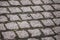 Cobbled pavement made of red and gray cobblestone. Small depth of field.