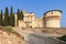 Cobbled road leading across drawbridge Ponte Levatoio to the castle of Brescia town and Tower of Prisoners