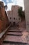 Cobbled staircase between stone houses in the center of VilafamÃ©s in CastellÃ³n Spain that ascend to the upper part of the town