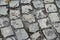 Cobbled street - Old square gray stones laid on the ground in a pedestrian street