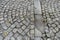 Cobbled street - Old square gray stones laid on the ground in a pedestrian street