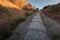 Cobbled walkway perspective, stone stairs going up