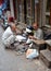 Cobbler repairs shoes in walled city Lahore, Pakistan