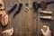 Cobbler tools in workshop dark background top view