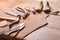 Cobbler tools in workshop on the wooden table .