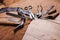 Cobbler tools in workshop on the wooden table . Space for text.