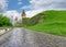 Cobbles road to the Kamianets-Podilskyi fortress after rain, Ukraine