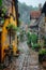 A cobblestone alleyway in an old European town