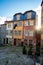 The  cobblestone courtyard area of streets in downtown Porto on a winter day, with colorful