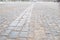 Cobblestone pavement.Vintage stone street road pavement texture.pattern of stone block paving.Selective focus.Granite