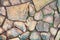 Cobblestone pebble abstract texture. Rusty stones of dried out pond