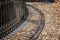 Cobblestone street in Sicily with shadows of rod iron fence