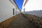 Cobblestone street and white colonial houses, Sucre, Bolivia.