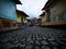 Cobblestone streets alley in picturesque colorful facades town village Guatape Pueblo de Zocalos in Antioquia Colombia