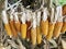 Cobs of corn drying in the open air. Connected with each other glumes. Hang on a tight rope. Crops harvested from the infield.