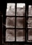 COBWEBS COVERING WINDOWS IN DERELICT TEXTILE MILL