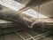 Cobwebs on a steel roof truss in a warehouse building