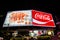 The Coca-Cola billboard at the top of William Street, Kings Cross, Sydney at night.