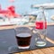 Coca-Cola bottle and a glass on the table of a beach bar