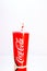 Coca Cola paper cup. Illustrative editorial photo in studio in Bucharest, Romania, 2021