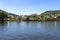 Cochem, Germany, June 13, 2021. Beautiful view of the colorful buildings along the river and the old town of Cochem on the Moselle