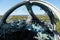 Cockpit of wrecked military aircraft. Blisters are broken