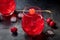 Cocktail cherry and a mocktail on a dark background, a vibrant red drink