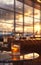 Cocktail glass on airport lounge table,background of large windows,airplanes and sunset outside