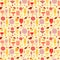 Cocktail glasses in various colors and sizes on yellow background. Seamless pattern.