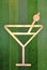 Cocktail symbol on green wood