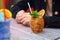 Cocktail in a wooden barrel glass on the table