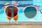 Cocktails near swimming pool, view through sunglasses