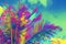 Coco palm tree crown on sky background. Psychedelic palm leaf on vivid sky. Tropical vacation digital illustration.