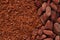 Cocoa beans and grated chocolate background