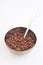 Cocoa coated puffed rice in metal bowl