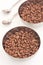 Cocoa coated puffed rice in metal bowls on white