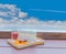 Cocoa, coffee, rainbow crepe, lemon, grape, on the wooden tray with the beautiful blue sky and cloud